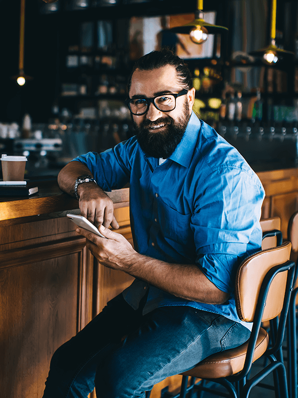 Small business owner sitting at bar (1)